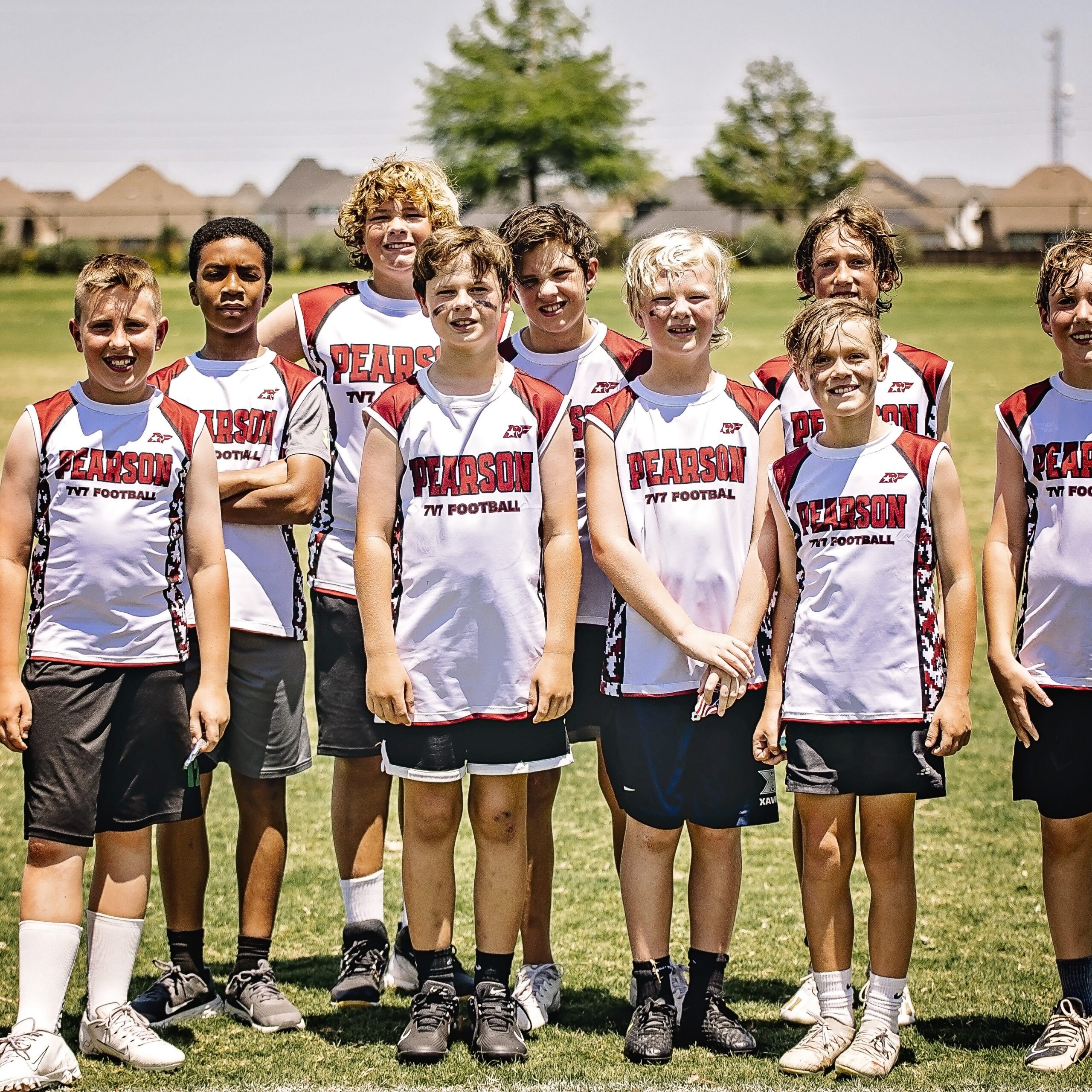 Pearson 7-on-7 football players standing together on a sunny field